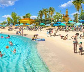 A stretch of gorgeous beach and crystal blue water with kayak and paddleboard rentals and plenty of space for games or lounging